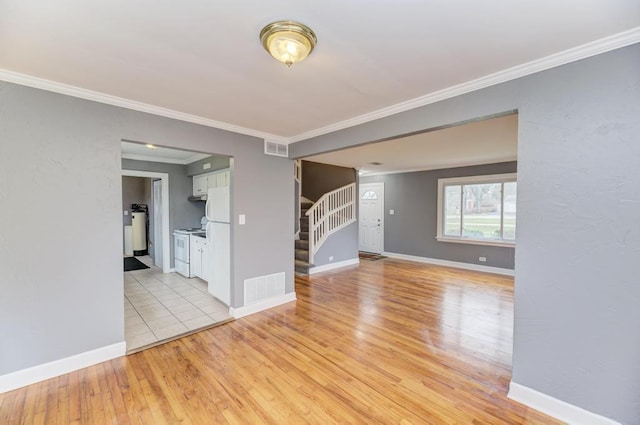 26W441 Geneva Rd, Wheaton, IL 60187 - unfurnished room with ornamental molding, stairs, visible vents, and light wood-style floors