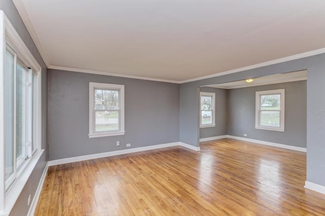 26W441 Geneva Rd, Wheaton, IL 60187 - spare room with light wood-type flooring, plenty of natural light, crown molding, and baseboards