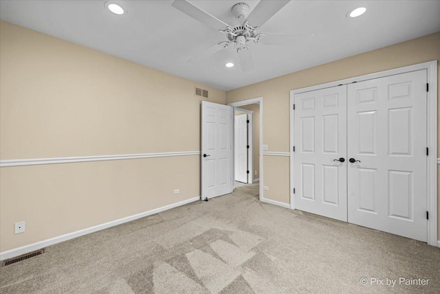 unfurnished bedroom featuring visible vents, carpet flooring, baseboards, and recessed lighting