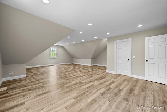 bonus room featuring recessed lighting, light wood-style floors, and baseboards