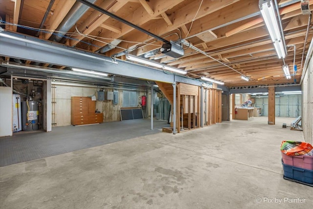 unfinished below grade area featuring gas water heater