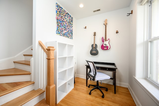 office featuring visible vents, baseboards, recessed lighting, and wood finished floors