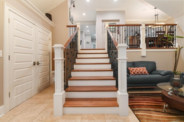 111 Grace Ln, Fox River Grove, IL 60021 - staircase with baseboards, stone tile floors, and a chandelier