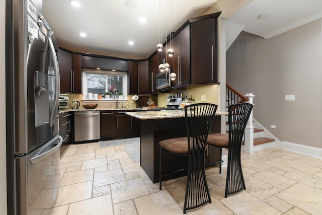 111 Grace Ln, Fox River Grove, IL 60021 - kitchen with stone tile flooring, crown molding, dark brown cabinets, light stone countertops, and appliances with stainless steel finishes