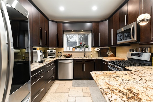 111 Grace Ln, Fox River Grove, IL 60021 - kitchen with stone tile flooring, tasteful backsplash, light stone counters, a sink, and stainless steel appliances
