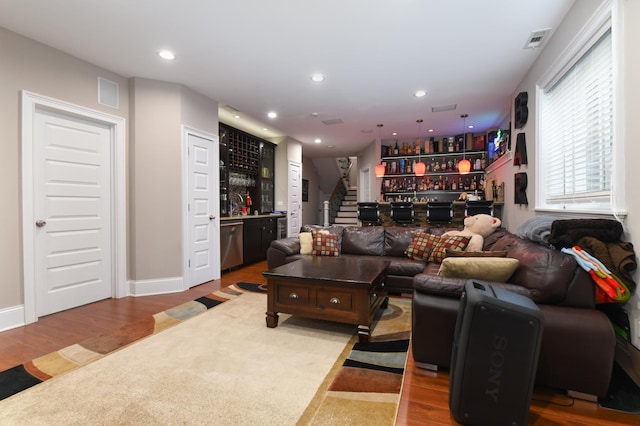 111 Grace Ln, Fox River Grove, IL 60021 - living room with visible vents, a dry bar, wood finished floors, and stairway