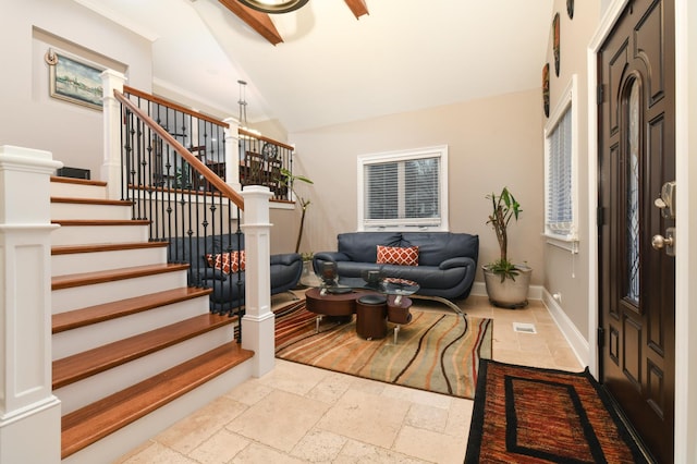 111 Grace Ln, Fox River Grove, IL 60021 - living room featuring stairway, baseboards, vaulted ceiling, and stone tile floors