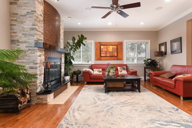 111 Grace Ln, Fox River Grove, IL 60021 - living room featuring crown molding, wood finished floors, a stone fireplace, recessed lighting, and a ceiling fan