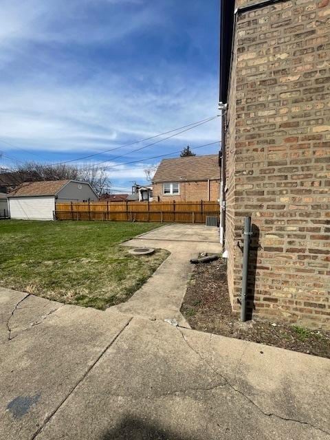 view of yard with a patio and fence