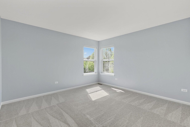 591 Waterford Rd, Elgin, IL 60124 - empty room featuring baseboards and carpet