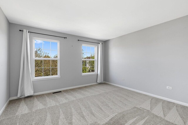 591 Waterford Rd, Elgin, IL 60124 - carpeted spare room with baseboards