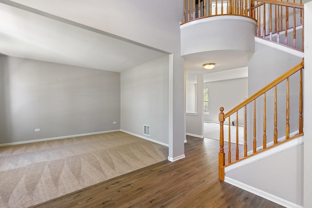 591 Waterford Rd, Elgin, IL 60124 - foyer entrance with baseboards, wood finished floors, stairs, carpet flooring, and a high ceiling