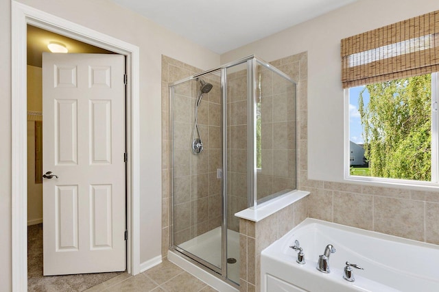 591 Waterford Rd, Elgin, IL 60124 - full bath featuring a shower stall, a bath, and tile patterned flooring