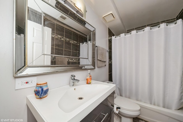 full bathroom with toilet, a sink, and shower / bath combo