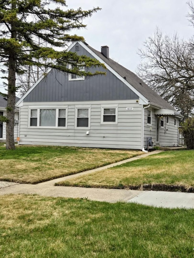 16117 Wolcott Ave, Markham, IL 60428 - view of property exterior featuring a yard and a chimney