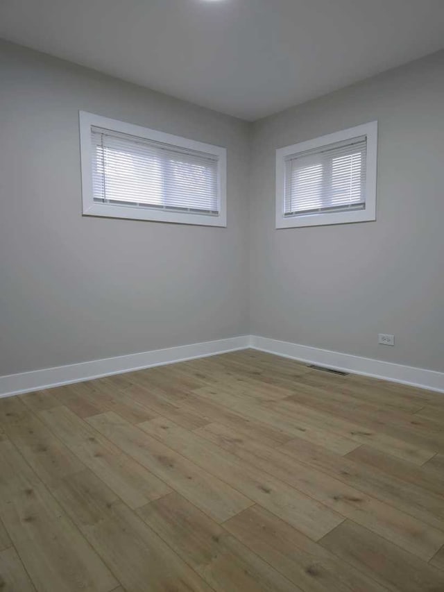 16117 Wolcott Ave, Markham, IL 60428 - unfurnished room featuring visible vents, baseboards, and light wood-type flooring