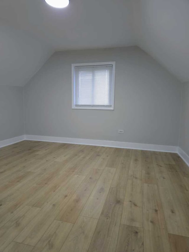 16117 Wolcott Ave, Markham, IL 60428 - additional living space featuring light wood-style floors, baseboards, and lofted ceiling