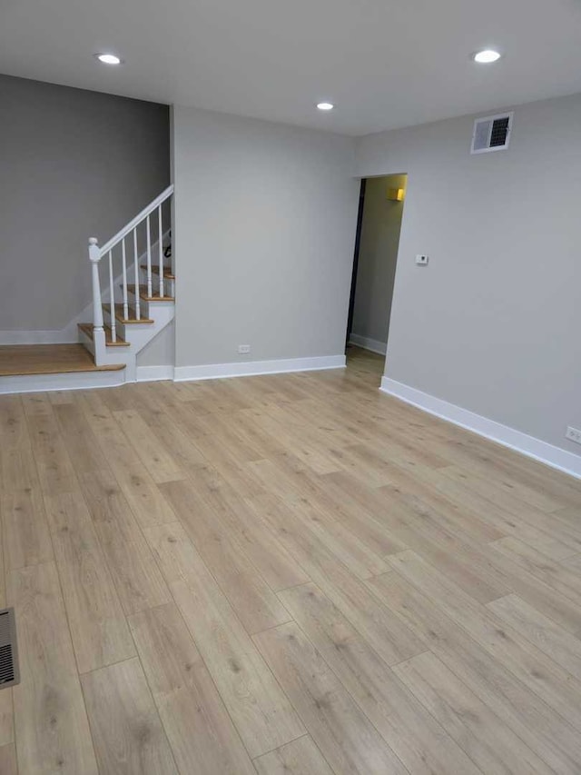 16117 Wolcott Ave, Markham, IL 60428 - spare room featuring light wood-style floors, stairway, visible vents, and baseboards