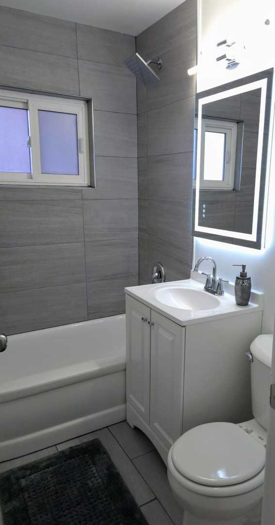 16117 Wolcott Ave, Markham, IL 60428 - full bath featuring tile patterned floors, toilet, shower / bathing tub combination, and vanity
