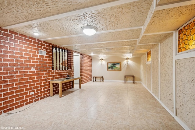 6920 N Avers Ave, Lincolnwood, IL 60712 - finished below grade area with brick wall, visible vents, and tile patterned floors