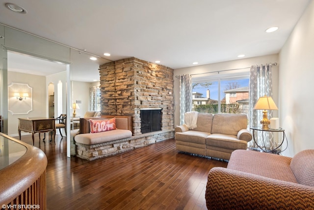 6920 N Avers Ave, Lincolnwood, IL 60712 - living room with wood-type flooring, arched walkways, and a fireplace