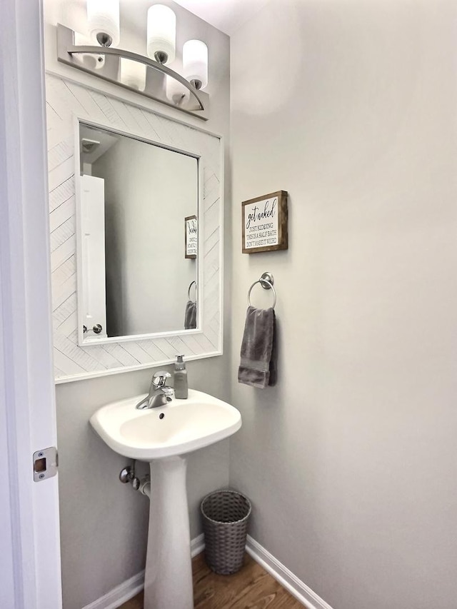 102 W Auburndale Ave, Cortland, IL 60112 - bathroom with baseboards and wood finished floors