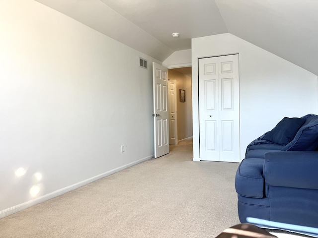 102 W Auburndale Ave, Cortland, IL 60112 - living area featuring baseboards, visible vents, light carpet, and lofted ceiling