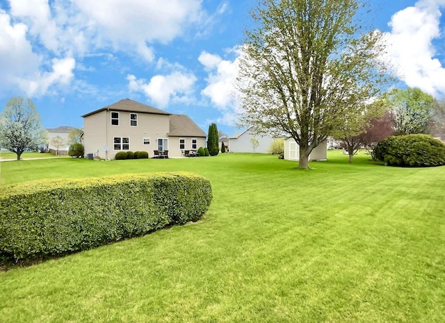102 W Auburndale Ave, Cortland, IL 60112 - view of yard featuring a storage unit and an outdoor structure