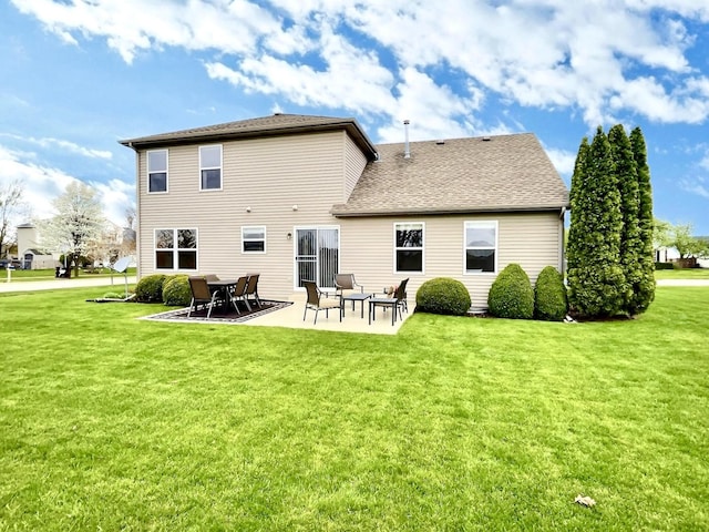 102 W Auburndale Ave, Cortland, IL 60112 - back of house featuring a yard, a patio, and a shingled roof