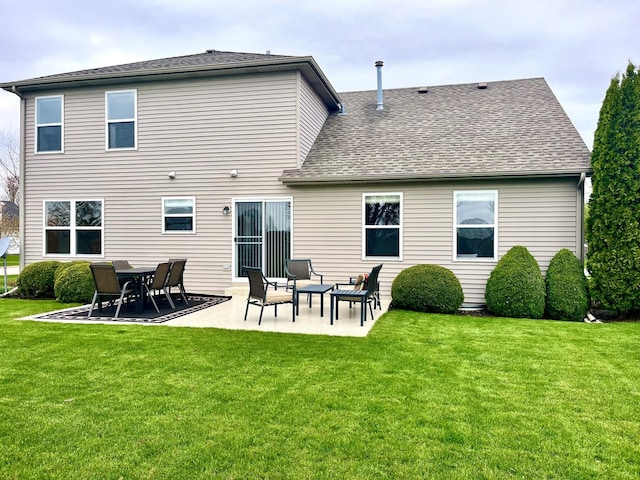 102 W Auburndale Ave, Cortland, IL 60112 - rear view of property with a lawn, a patio, and roof with shingles