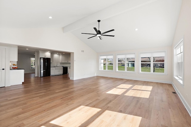 15150 109th Ave, Orland Park, IL 60467 - unfurnished living room with beamed ceiling, high vaulted ceiling, a ceiling fan, healthy amount of natural light, and light wood finished floors