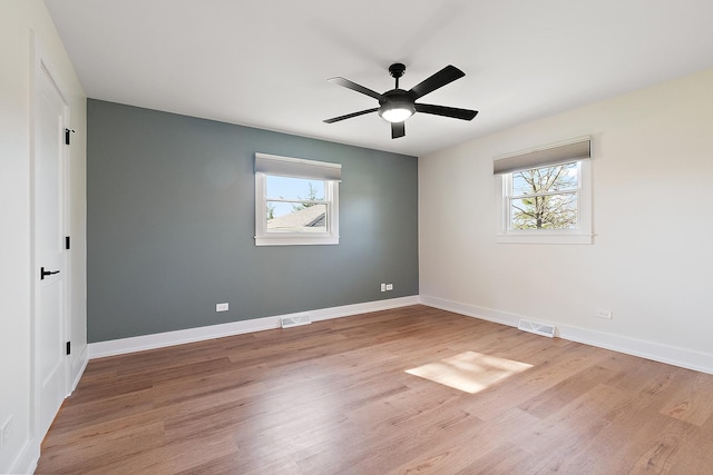 15150 109th Ave, Orland Park, IL 60467 - empty room featuring plenty of natural light, wood finished floors, and ceiling fan
