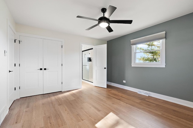 15150 109th Ave, Orland Park, IL 60467 - unfurnished bedroom featuring light wood finished floors, baseboards, a closet, and ceiling fan