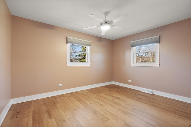 15150 109th Ave, Orland Park, IL 60467 - spare room featuring light wood-style floors, baseboards, and a ceiling fan