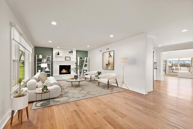 15150 109th Ave, Orland Park, IL 60467 - living area featuring wood finished floors, recessed lighting, baseboards, and a fireplace