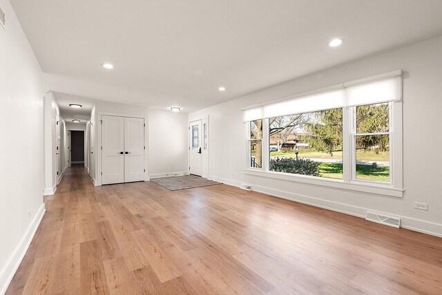 15150 109th Ave, Orland Park, IL 60467 - unfurnished living room featuring light wood-type flooring, recessed lighting, and baseboards