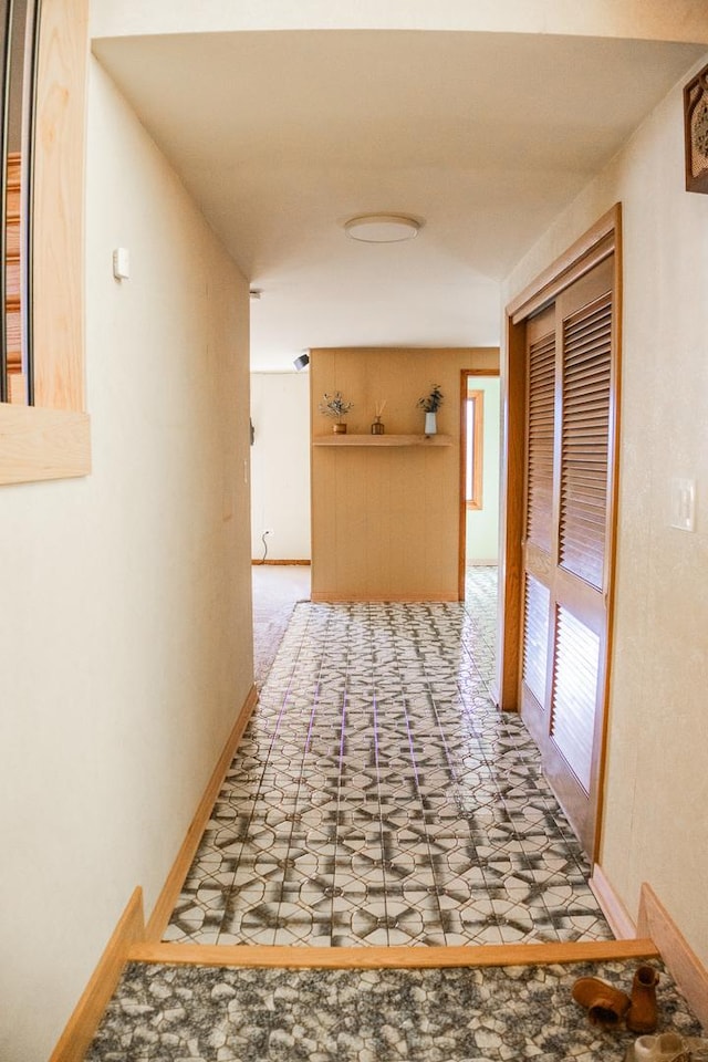 hallway featuring baseboards