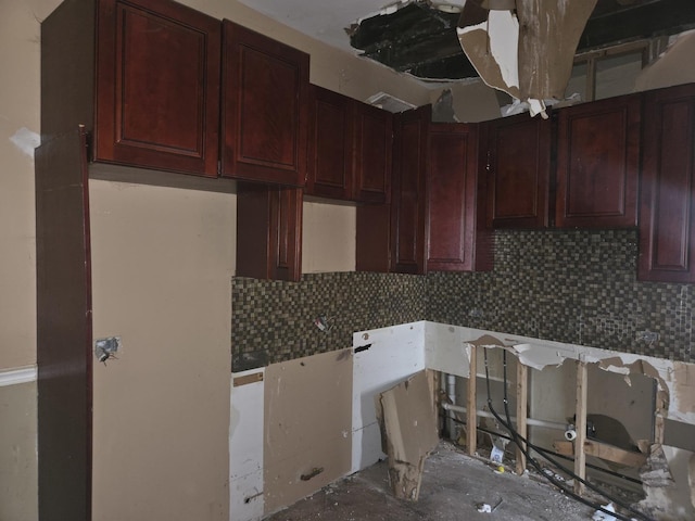 kitchen with decorative backsplash and dark brown cabinets