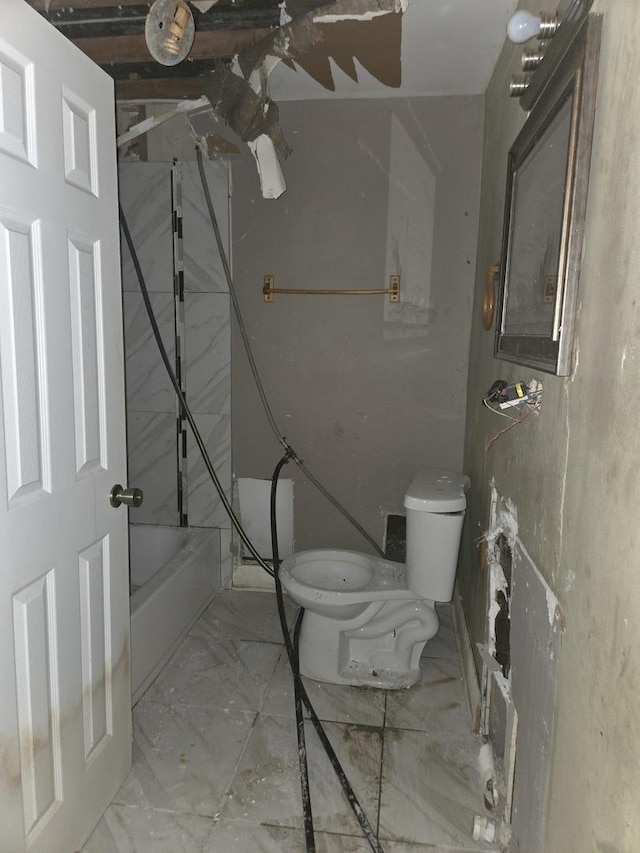 full bathroom with marble finish floor and toilet