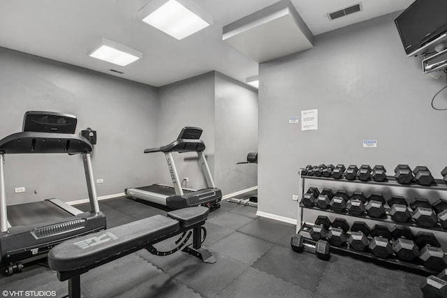 workout area with visible vents and baseboards