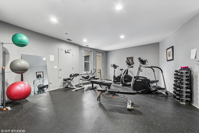 workout area featuring visible vents, baseboards, and recessed lighting