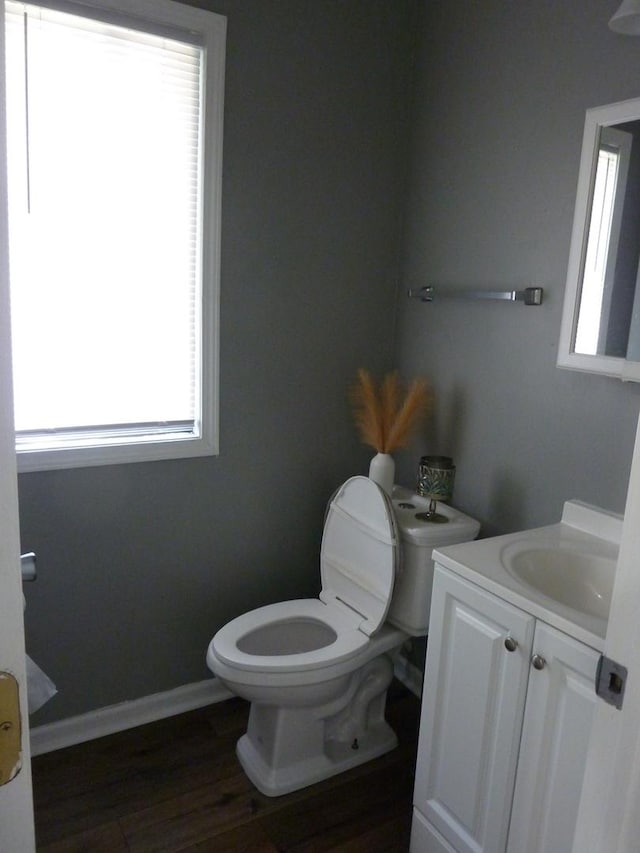 275 London Pl Unit 275, Wheeling, IL 60090 - half bathroom featuring baseboards, wood finished floors, toilet, and vanity