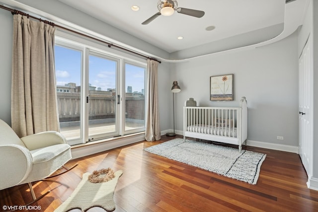 bedroom with a ceiling fan, wood finished floors, baseboards, access to exterior, and recessed lighting