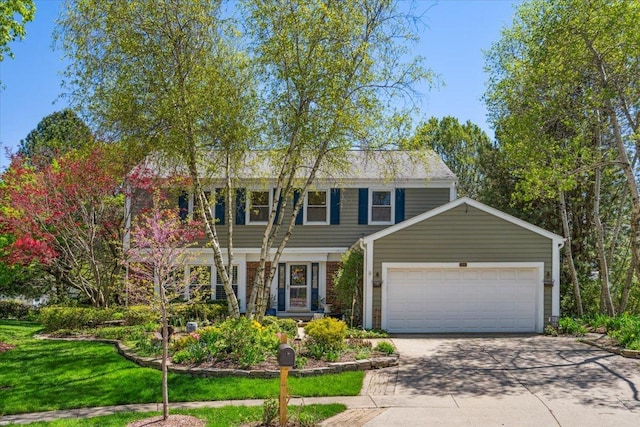 401 Aurora Ct, Vernon Hills, IL 60061 - colonial-style house with driveway, a garage, and a front yard