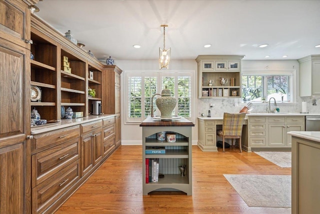 401 Aurora Ct, Vernon Hills, IL 60061 - kitchen featuring open shelves, light countertops, light wood finished floors, backsplash, and pendant lighting