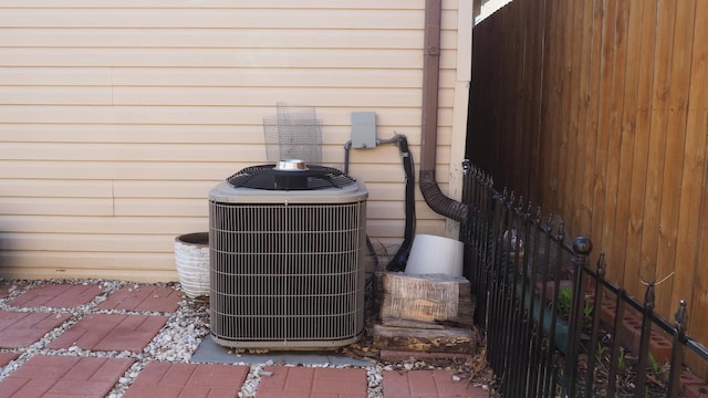 3005 N Kostner Ave, Chicago, IL 60641 - exterior details featuring central air condition unit and fence