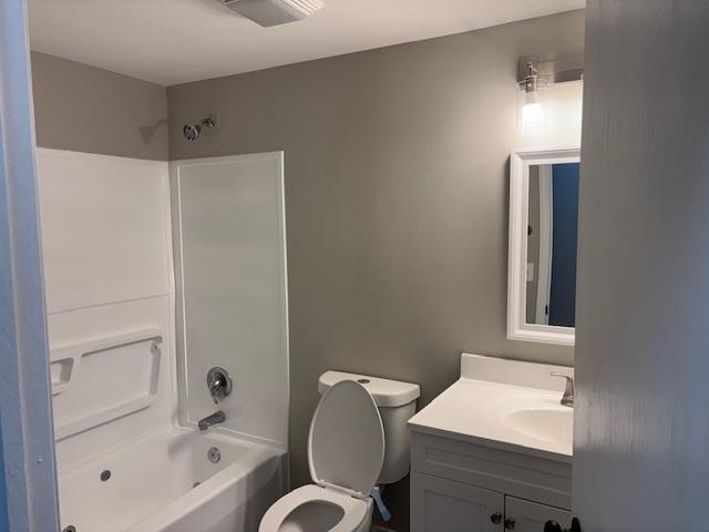 638 Virgil Ave, Elgin, IL 60120 - bathroom featuring vanity, toilet, and shower / washtub combination