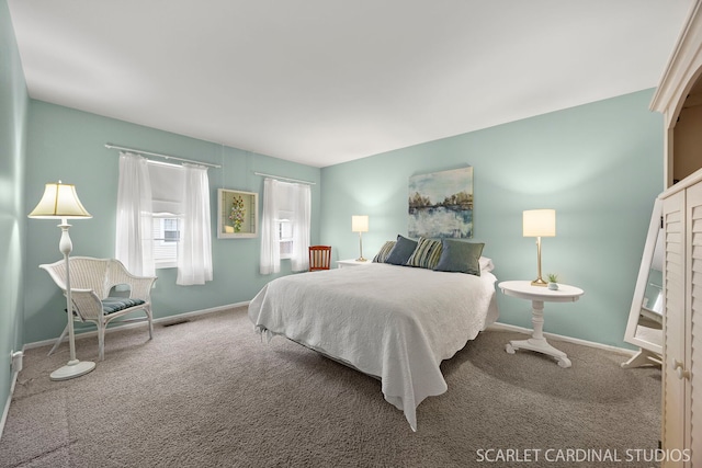 bedroom featuring baseboards, visible vents, and carpet