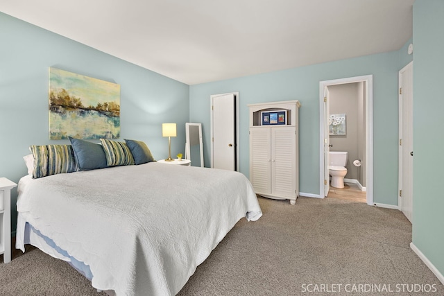 bedroom featuring baseboards, carpet floors, and connected bathroom