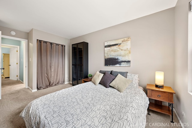 bedroom featuring carpet flooring and baseboards